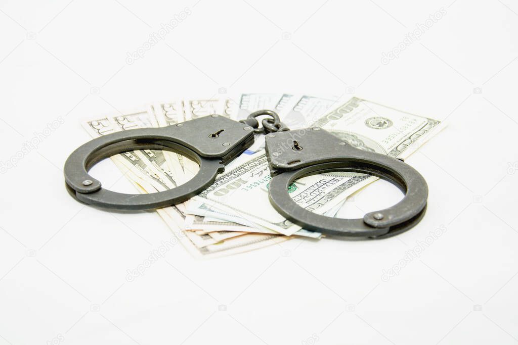 Metal police handcuffs on a white background close up