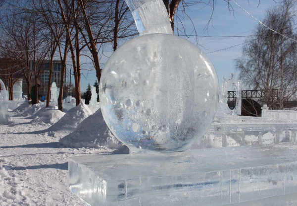 ice figures decorative sculpture ball sparkles from transparent snow in the park