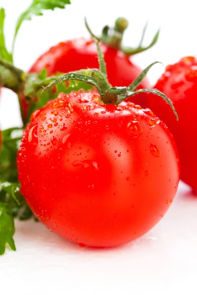 Juicy organic Cherry tomatoes with green leaf isolated over whit — Stock Photo, Image