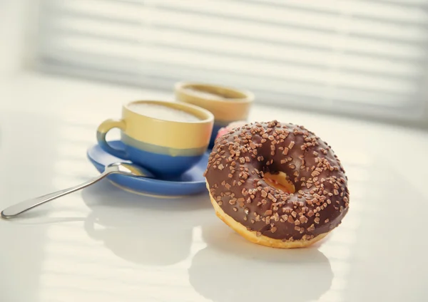 Hot coffee and donut in morning. Soft vintage colors — Stock Photo, Image