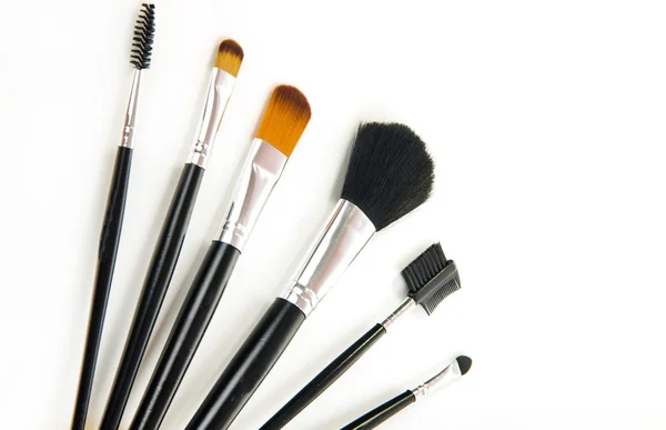 Different professional cosmetic brushes on white background — Stock Photo, Image