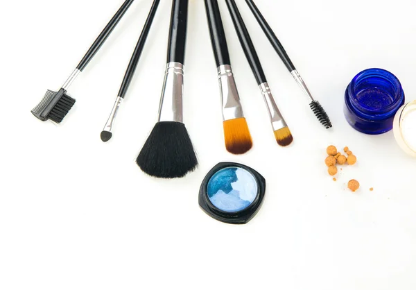 Brushes and cosmetic on a white background — Stock Photo, Image