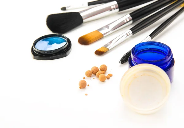 Brushes and cosmetic on a white background — Stock Photo, Image