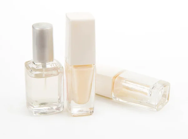 Tres esmalte de uñas transparente aislado sobre fondo blanco — Foto de Stock