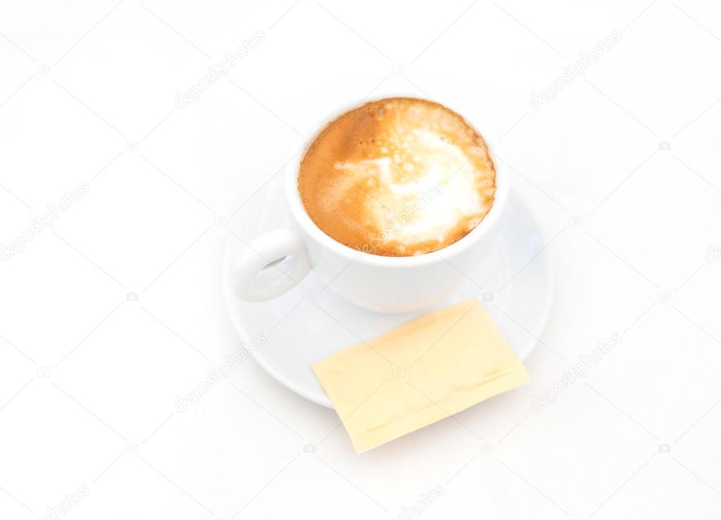 one white cup of Cappuccino coffee with heart shaped milk foam
