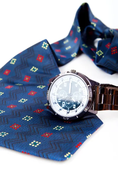 Classic business watches and abstract blue necktie isolated on w — Stock Photo, Image