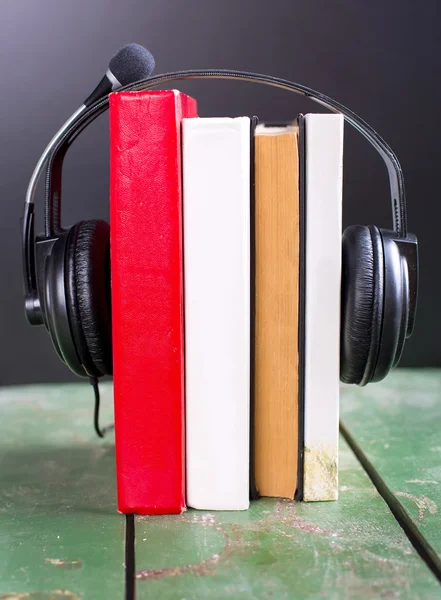 colorful audio book concept with headphones and books