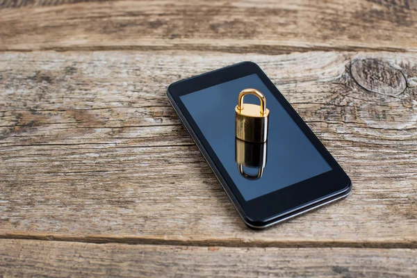 Modern smartphone with combination lock padlock. Concept of mobi — Stock Photo, Image
