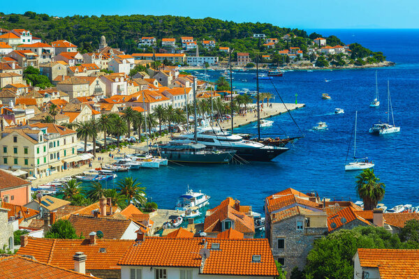Majestic mediterranean cityscape and harbor with yachts and sailing boats, Hvar island, Dalmatia, Croatia, Europe