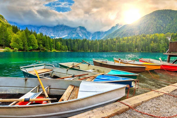 Stunning alpine landscape and colorful boats, Lake Fusine, Italy, Europe — стоковое фото