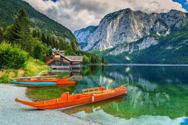 Boathouse and wooden boats on the lake,Altaussee,Salzkammergut,Austria clipart