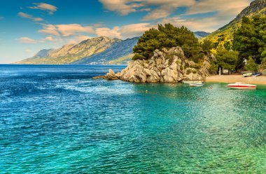 Beautiful bay and beach with motorboats,Brela,Dalmatia region,Croatia,Europe clipart