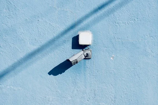 security camera on the wall of the building