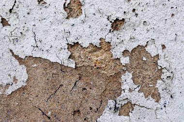 Eski beton duvarların detaylı yakın görüntüsü çatlaklar ve yapılandırılmış detaylar.