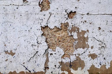Eski beton duvarların detaylı yakın görüntüsü çatlaklar ve yapılandırılmış detaylar.