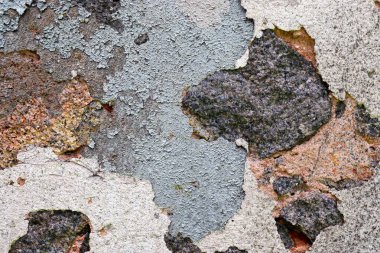 Eski beton duvarların detaylı yakın görüntüsü çatlaklar ve yapılandırılmış detaylar.