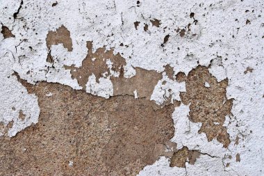 Eski beton duvarların detaylı yakın görüntüsü çatlaklar ve yapılandırılmış detaylar.