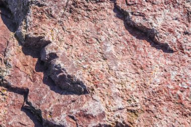 Granit taş dokusu yüksek çözünürlüklü detaylı bir yakın çekim görüntüsüyle.