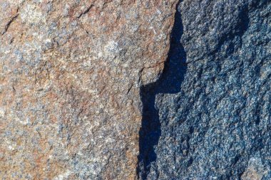 Granit taş dokusu yüksek çözünürlüklü detaylı bir yakın çekim görüntüsüyle.