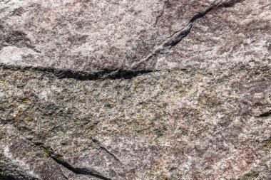Granit taş dokusu yüksek çözünürlüklü detaylı bir yakın çekim görüntüsüyle.