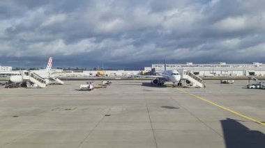 Valletta, Malta - 27. September 2024: Passenger view from an airplane window taxiing along the tarmac on a cloudy day