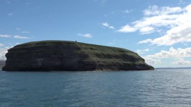 Stunning view of the lush, green Asbyrgi horseshoe canyon on a beautiful sunny summer day