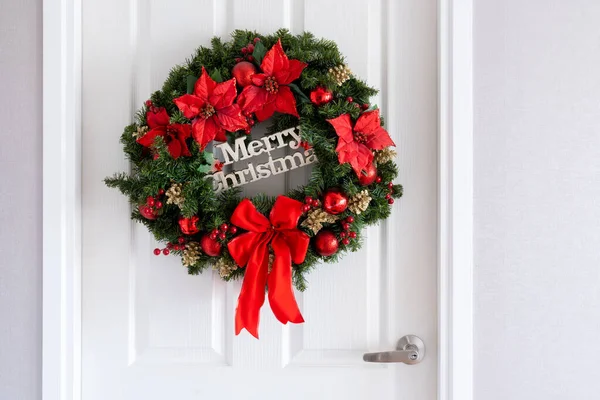 a christmas ornaments hang on a door