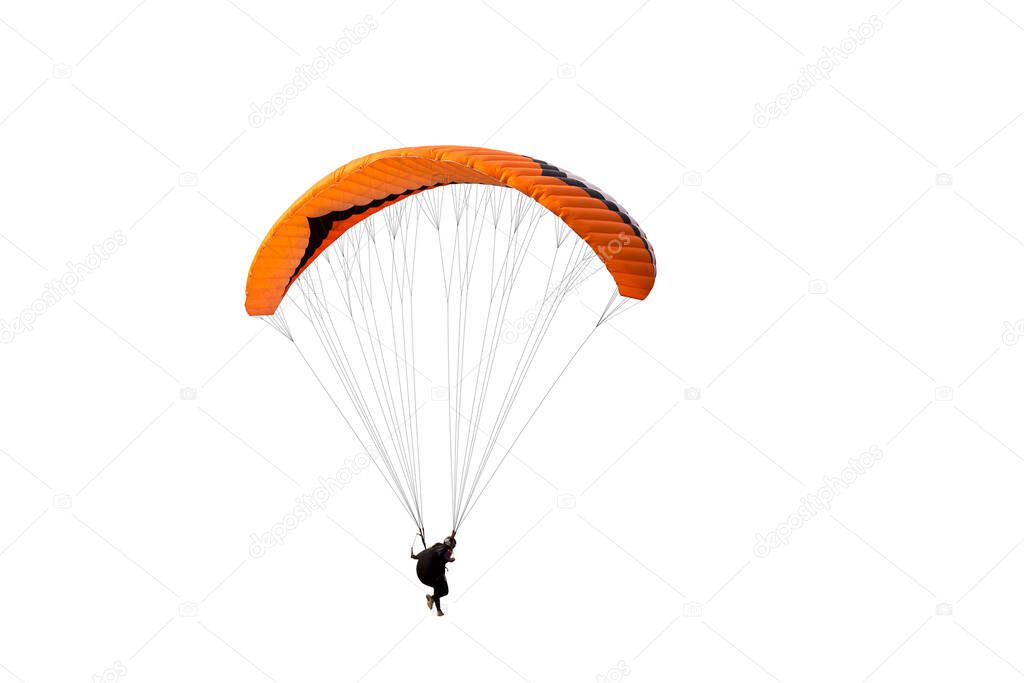 The sportsman flying on a paraglider. Beautiful paraglider in flight on isolated white background. 