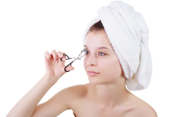 The girl in a towel after a shower, with curling tongs of eyelashes. — Stock Photo, Image