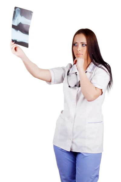 Female doctor looking at the x-ray image — Stock Photo, Image