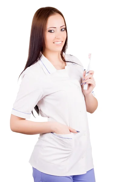 Doctora con cepillo de dientes en la mano — Foto de Stock