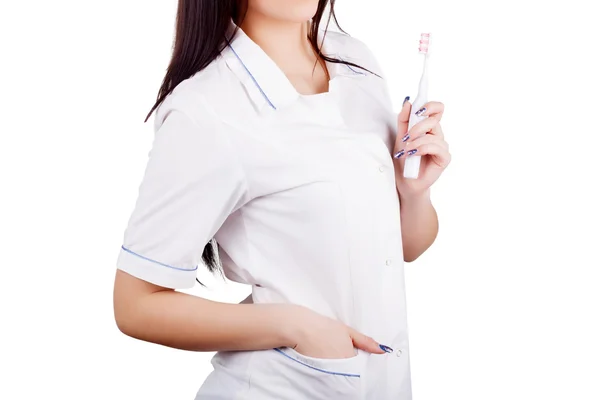 Woman doctor with toothbrush in hand — Stock Photo, Image