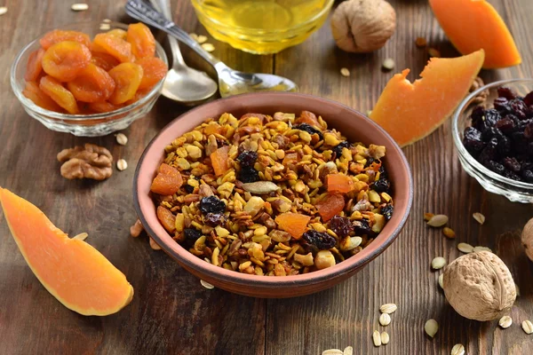 Pumpkin homemade granola with walnuts and dried fruits — Stock Photo, Image