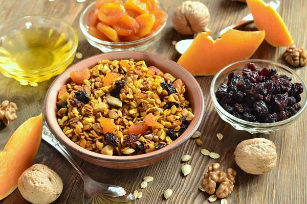 Pumpkin homemade granola with walnuts and dried fruits — Stock Photo, Image