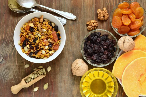 Pumpkin homemade granola with walnuts and dried fruits — Stock Photo, Image