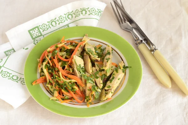 Chicken with julienne carrots and celery — Stock Photo, Image