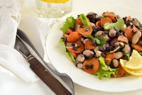 Beans salad with carrots and black rice — Stock Photo, Image