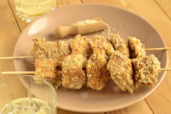 Chicken skewers in sesame breading — Stock Photo, Image