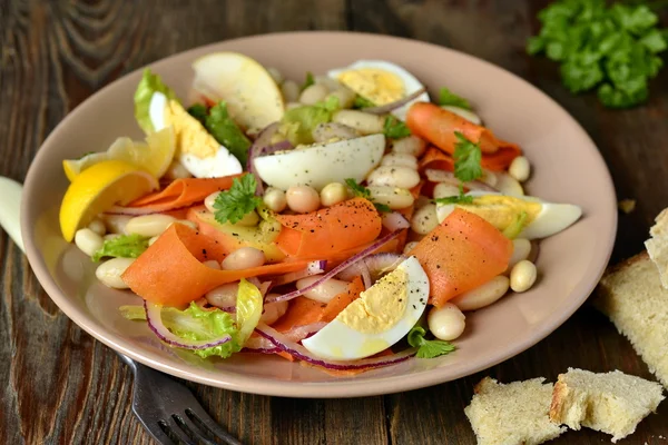 Salad with beans, egg, carrot and apple — Stock Photo, Image