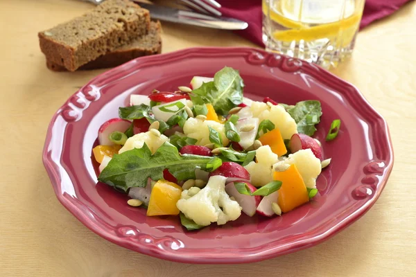 Salad with cauliflower, radish, sweet pepper and greens — Stock Photo, Image