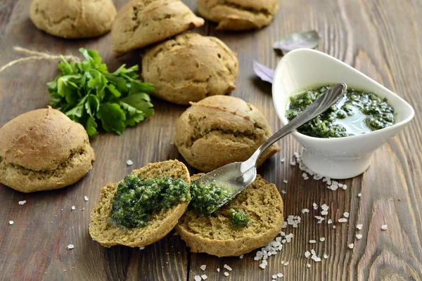 Small rye buns with oil with herbs — Stock Photo, Image