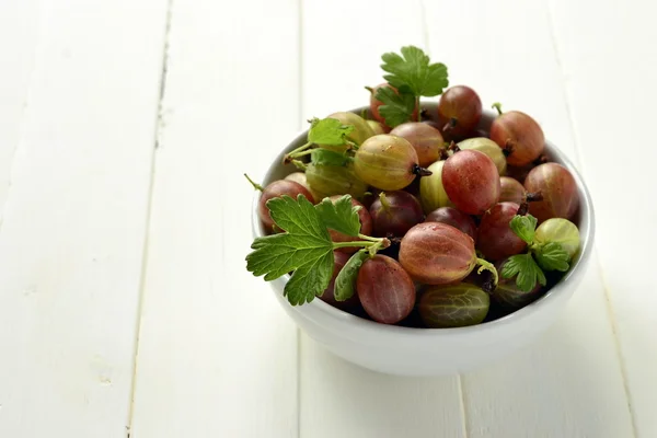 The organic gooseberries in a bowl Royalty Free Stock Photos