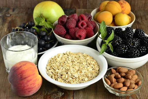 Cereals, almonds and various berries for breakfast — Stock Photo, Image