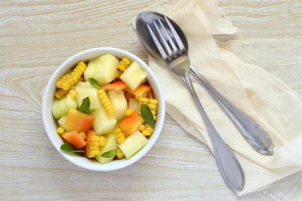 Salad with melon, corn and sweet pepper — Stock Photo, Image