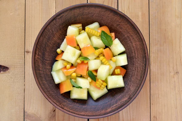 Salad with melon, corn and sweet pepper — Stock Photo, Image
