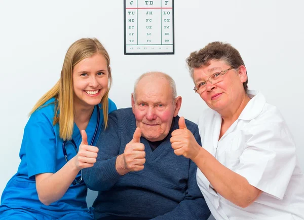 Thumbs Up From Elderly Man And His Caregivers Stock Fotó