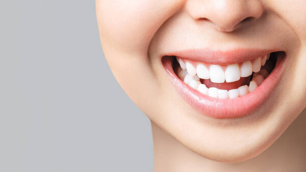 Perfect healthy teeth smile of a young asian woman. Teeth whitening. Dental clinic patient. Image symbolizes oral care dentistry, stomatology. Dentistry image