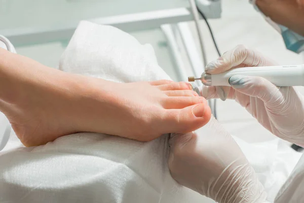 A Podiatrist doctor who takes care of a womans toenails. Cosmetic procedures of the feet