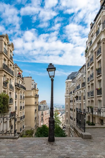 Paris, romantic staircase in Montmartre, typical buildings and floor lamp