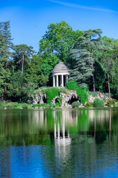 Vincennes, the temple of love and artificial grotto on the Daumesnil lake, in the public park